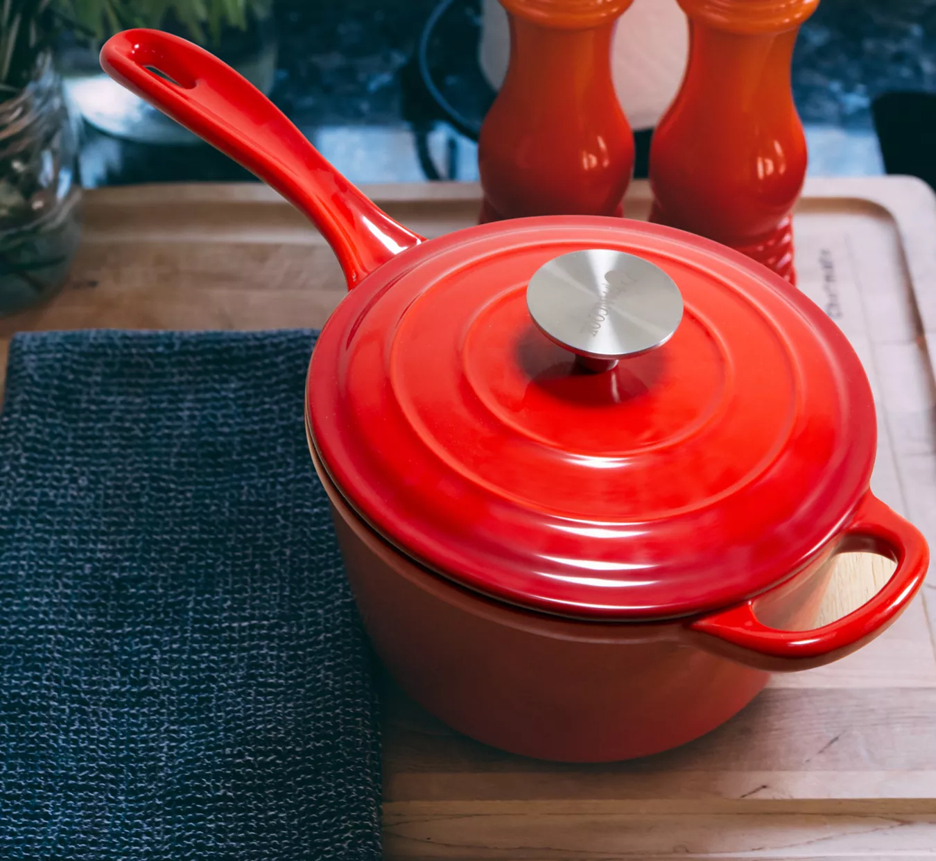 Photography of red Casserole with handle